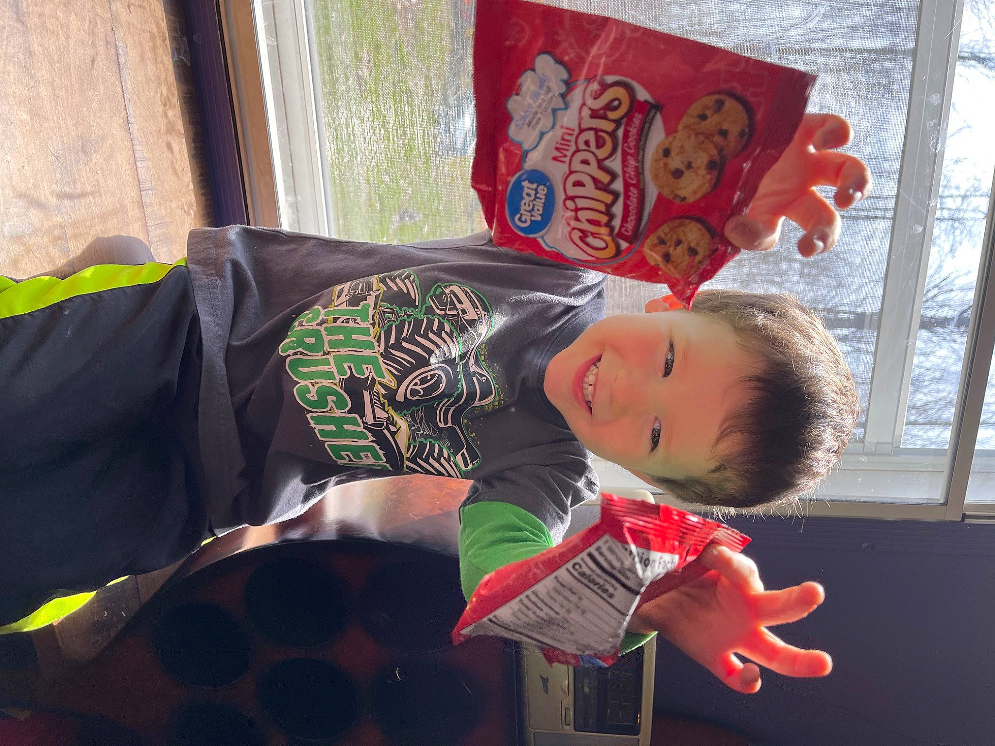 Clyde is registered to the contest to win money with this photo: child, costume, event, formal_wear, fun, happy, joy, pattern, person, room, sitting, sleeve, smile, suit, textile, toddler, wood