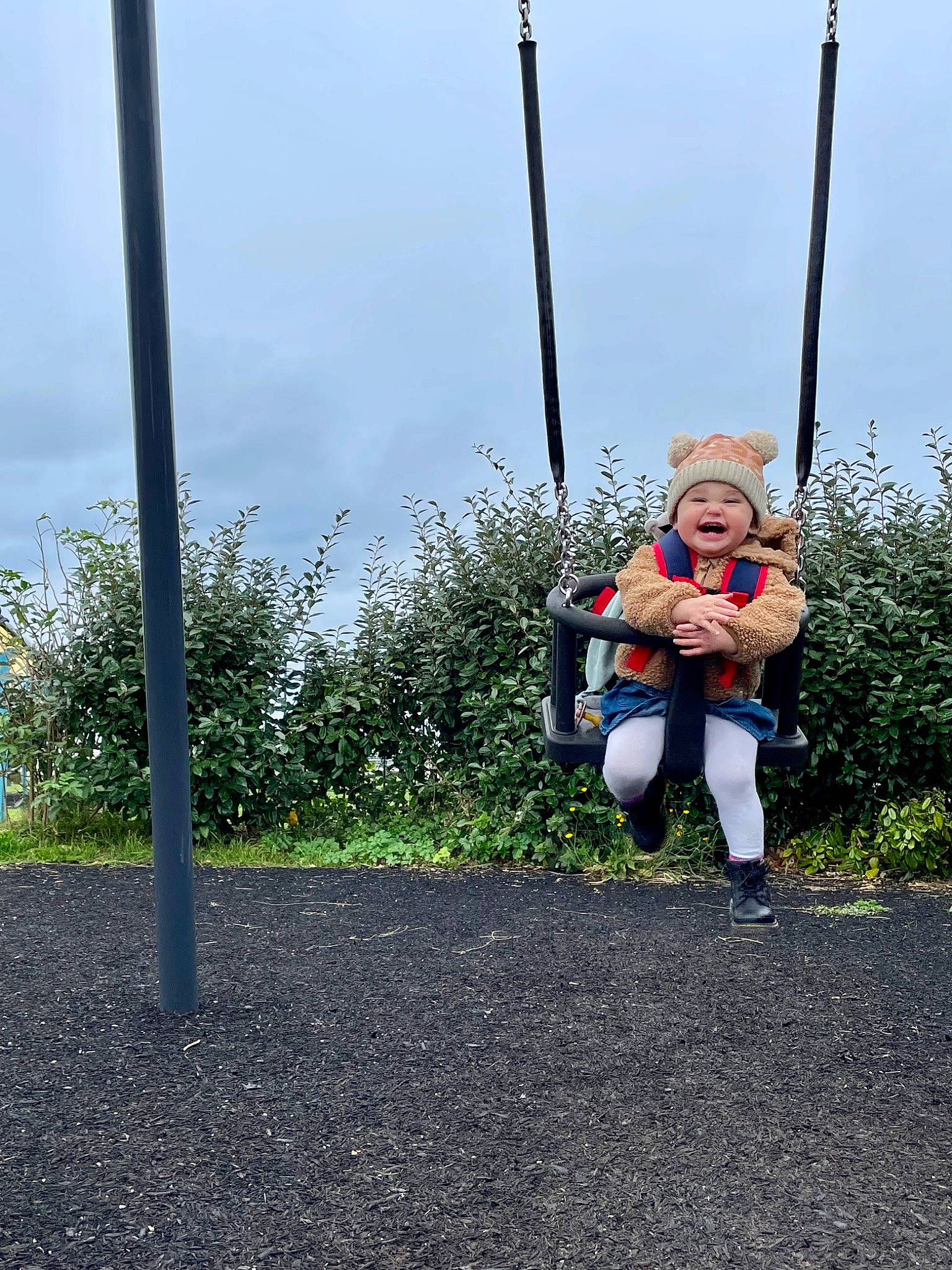 Isla-mae is registered to the contest to win money with this photo: asphalt, baby, city, electric_blue, fun, grass, happy, headwear, landscape, leisure, outdoor_play_equipment, people_in_nature, person, plant, playground, pole, recreation, road_surface, sky, soil