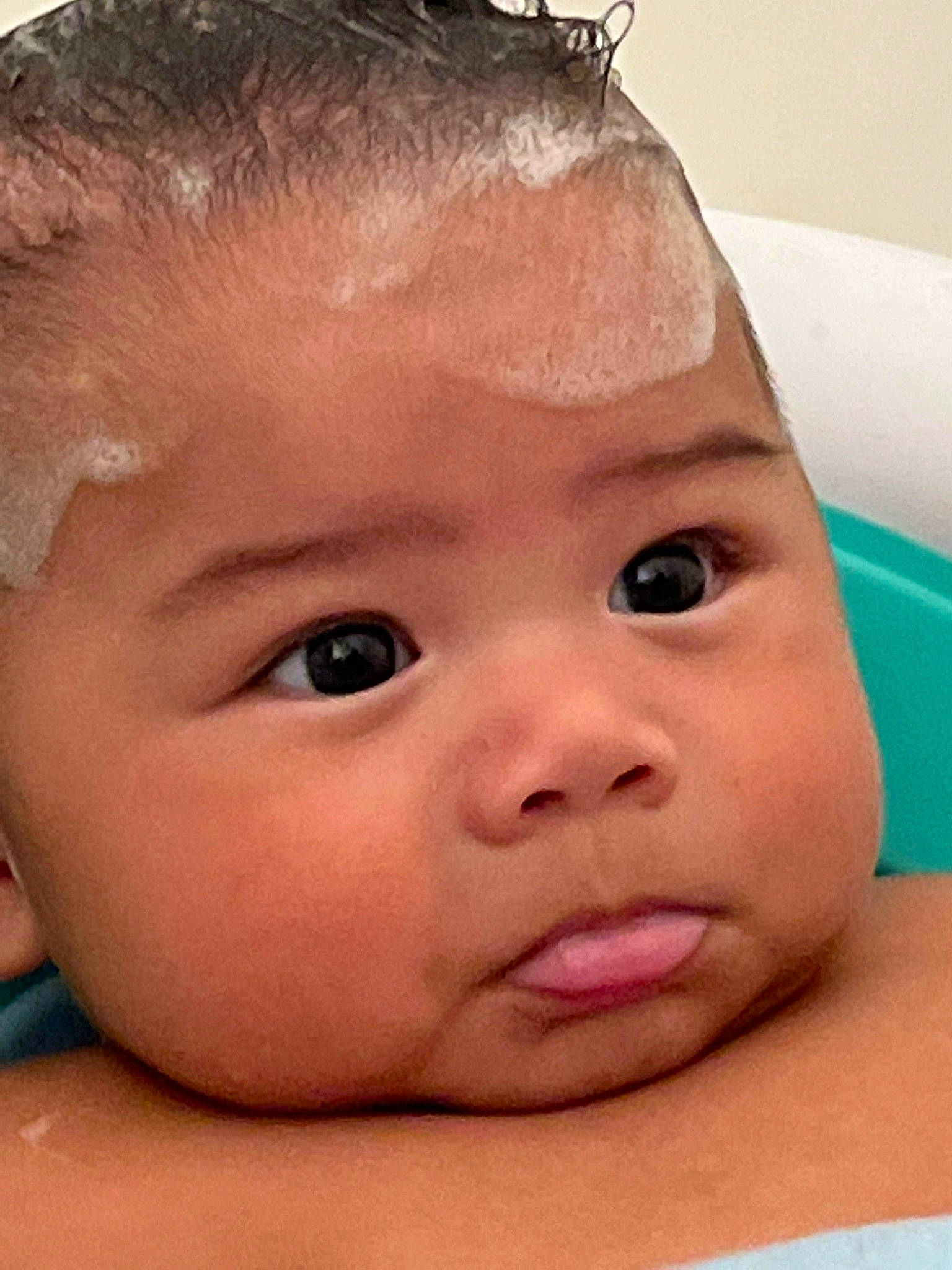 Luther is registered to the contest to win money with this photo: baby, bathing, cheek, chin, eye, eyebrow, eyelash, forehead, hair, hairstyle, happy, head, iris, lip, mouth, neck, nose, person, skin, smile