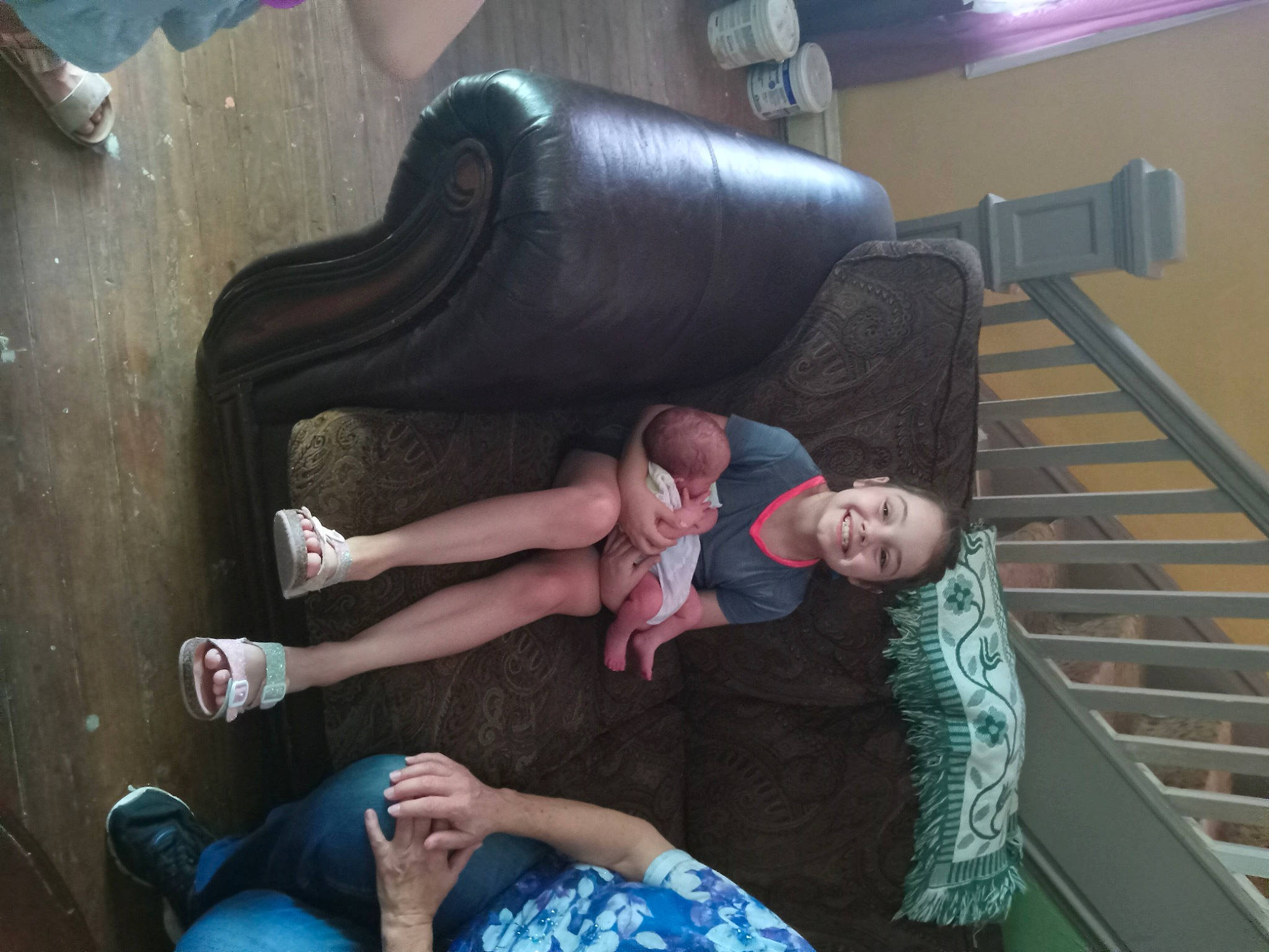 Nevaeh is registered to the contest to win money with this photo: child, comfort, flash_photography, foot, fun, human_leg, joy, lap, leisure, person, recreation, room, shorts, sitting, stairs, thigh