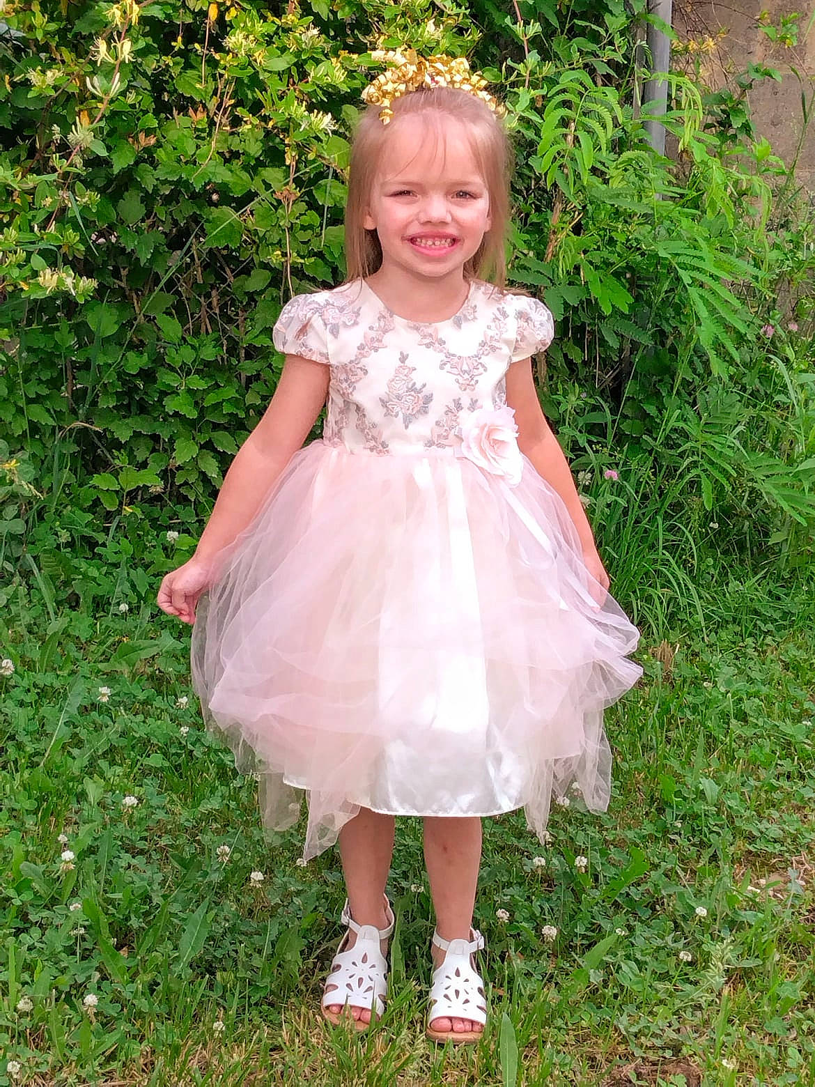 Jamie joined the competition — help win amazing prizes! baby_toddler_clothing, blond, bridal_accessory, bridal_party_dress, child, clothing, day_dress, dress, face, formal_wear, grass, happy, joy, one_piece_garment, pattern, people_in_nature, person, pink, plant, smile