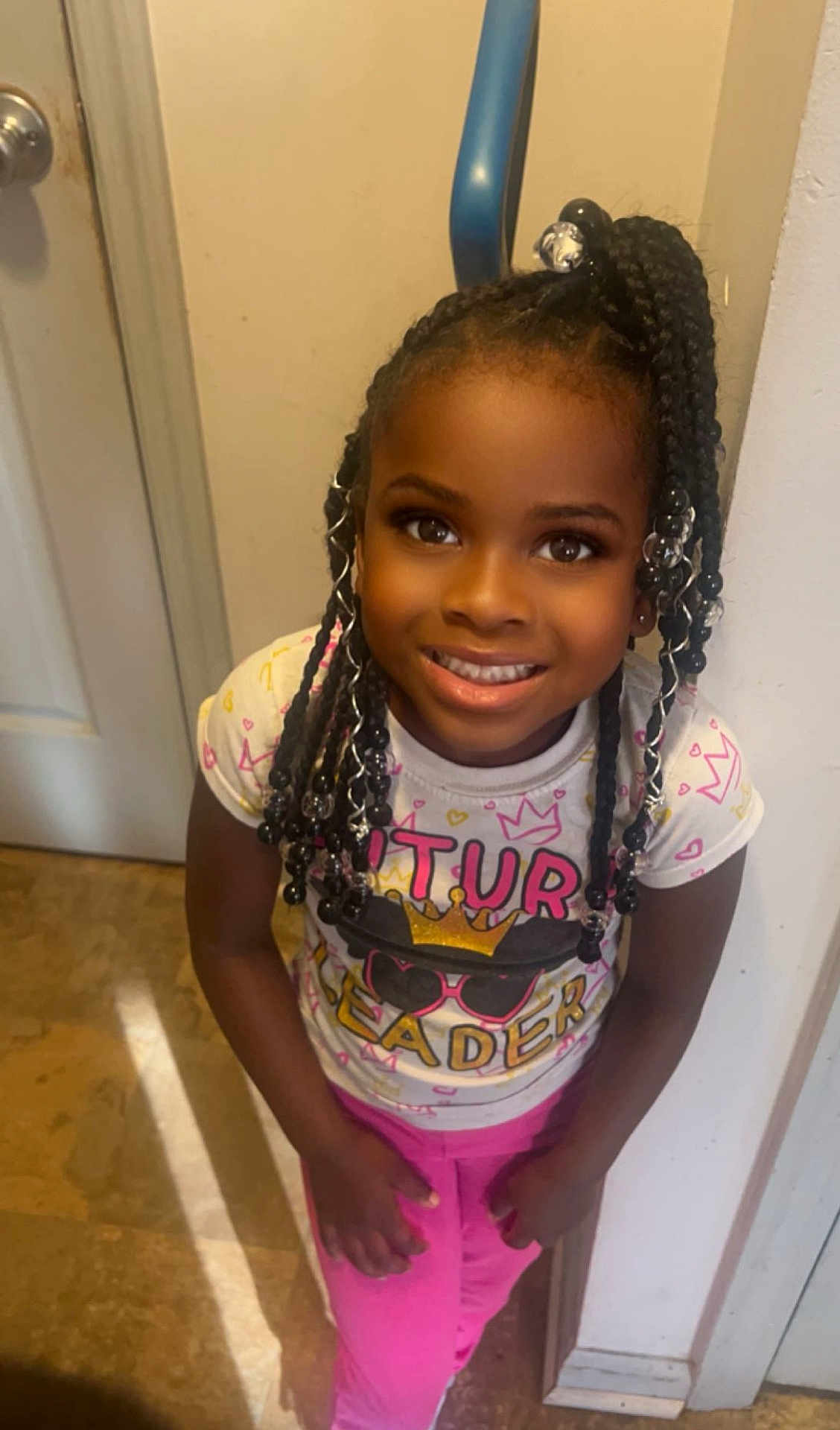 Alailah joined the competition — help win amazing prizes! blackhair, bodypart, braid, child, clothing, cornrows, dimples, door, face, female, girl, hair, happy, head, person, photography, portrait, sleeve, smile, t_shirt