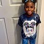 child, clothing, door, face, female, footwear, girl, happy, head, jeans, pants, person, photography, portrait, purple, shoe, sleeve, smile, standing, t_shirt