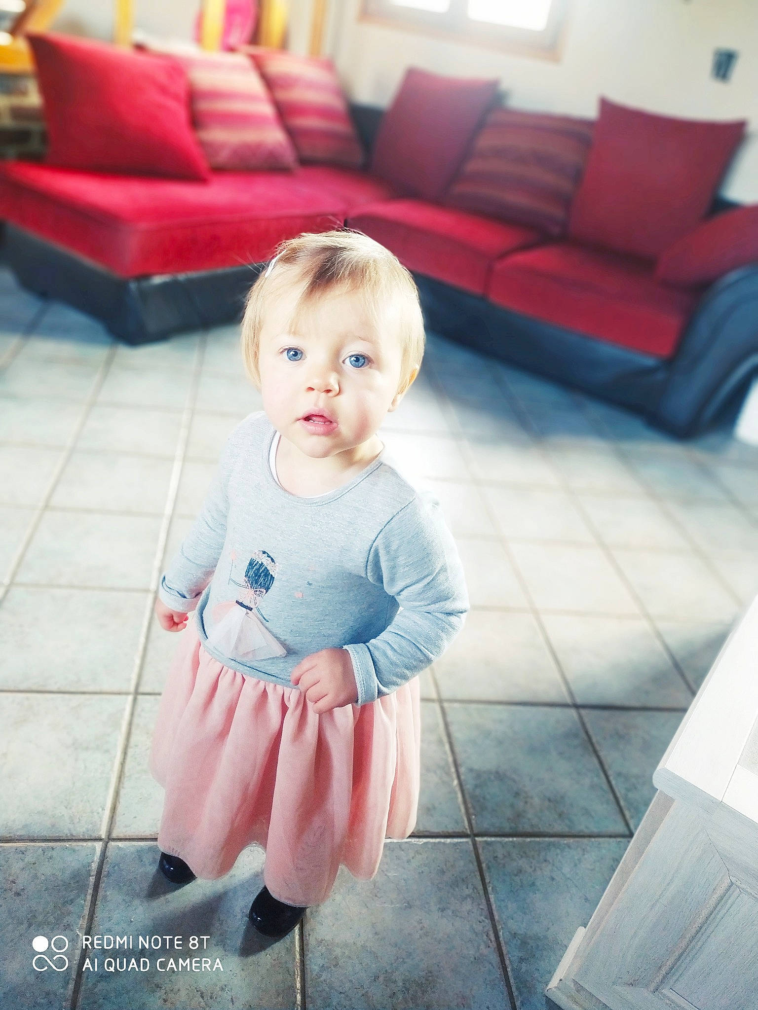 Celestine a rejoint le concours — aidez-le/la à gagner de superbes lots ! baby, baby_toddler_clothing, child, coffee_table, couch, cushion, floor, flooring, furniture, home, interior_design, living_room, person, pillow, pink, room, sofa_bed, studio_couch, throw_pillow, toddler