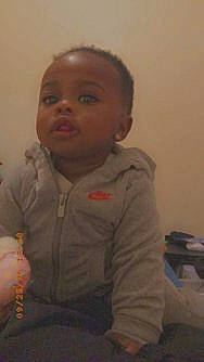 Anais is registered to the contest to win money with this photo: baby, cheek, child, chin, ear, eye, face, forehead, mouth, nose, person, portrait, sitting, smile, thumb, toddler