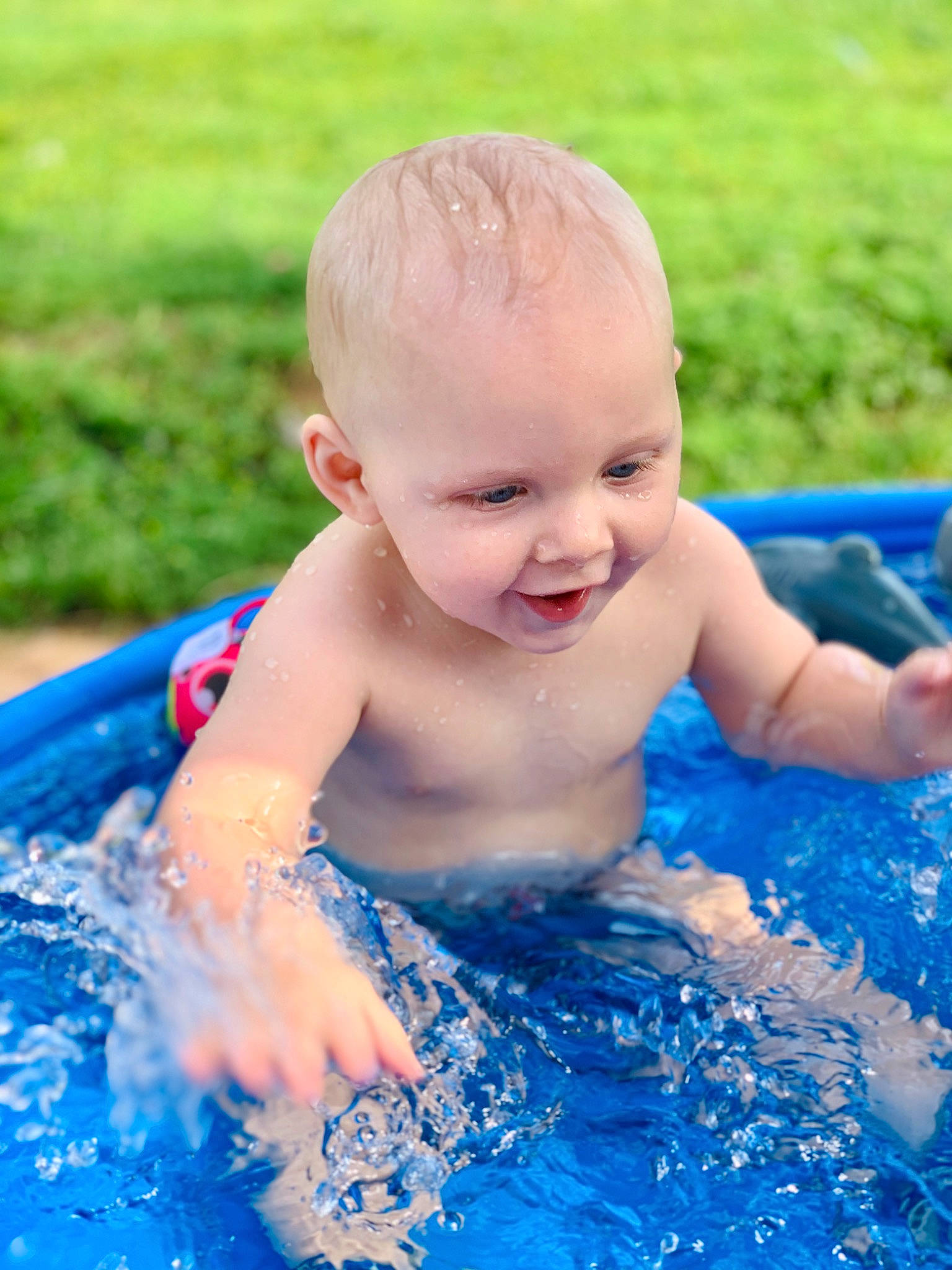 Reed joined the competition — help win amazing prizes! baby, baby_bathing, bathing, blue, child, eye, fun, grass, happy, leisure, person, play, product, recreation, skin, smile, summer, swimming_pool, toddler, vacation