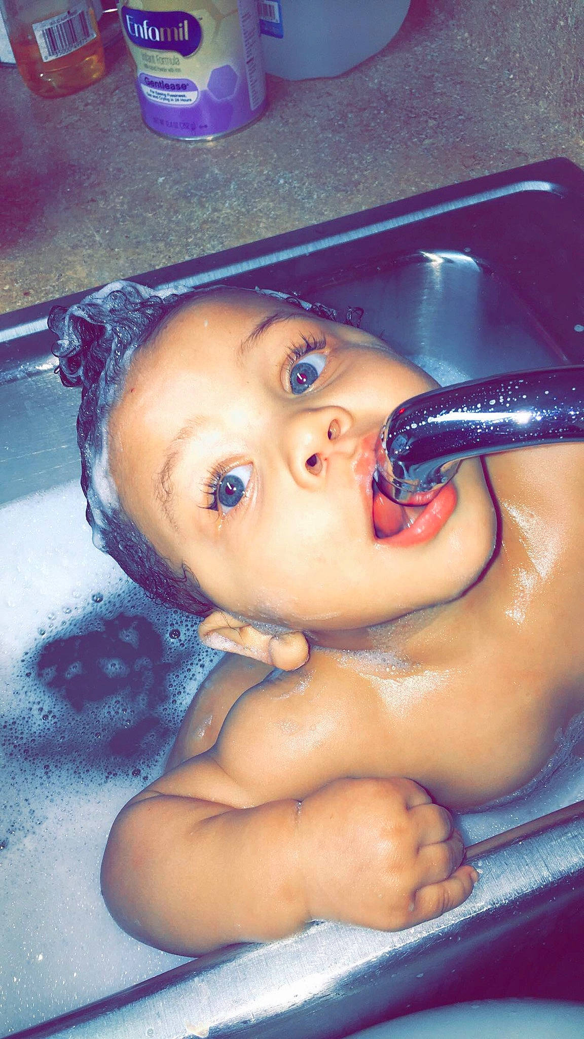 Coby is registered to the contest to win money with this photo: baby, bathing, cheek, child, ear, eye, eyebrow, face, forehead, fun, head, lip, mouth, muscle, nose, person, skin, smile, surprise, toddler
