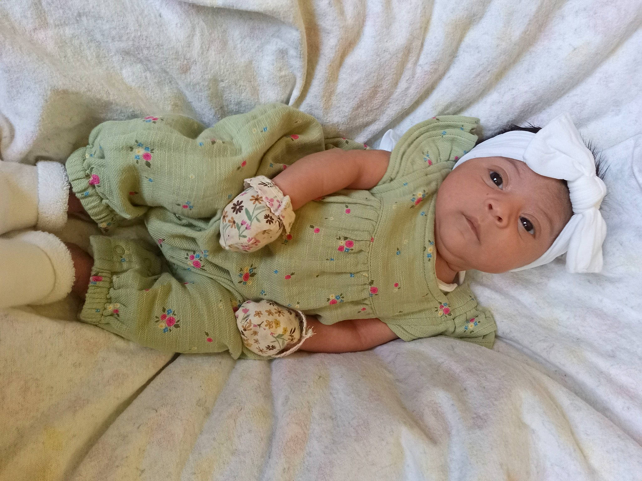 Leilani joined the competition — help win amazing prizes! baby, baby_products, baby_sleeping, baby_toddler_clothing, child, comfort, dress, eye, face, hand, hat, head, headwear, human_body, linens, mammal, pattern, person, skin, sleeve