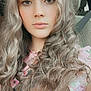 Addison is registered to the contest to win money with this photo: girl, child, portrait, curly_hair, blonde_hair, floral_top, car_seat, seatbelt, young, person, face, long_hair, casual, indoors, light, natural_light, sitting, looking_at_camera, calm, closeup