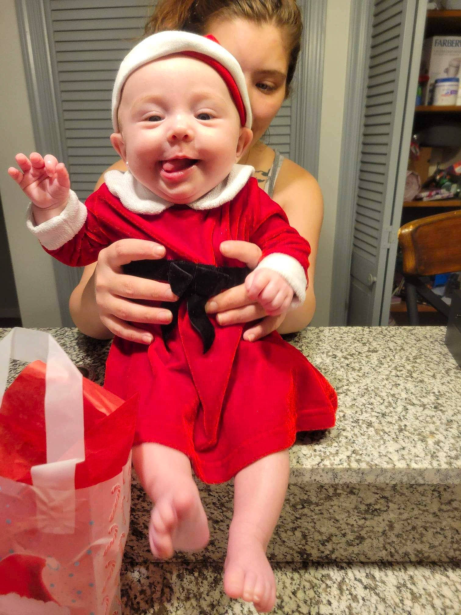 Allayna Grace joined the competition — help win amazing prizes! baby, baby_toddler_clothing, cheek, child, dress, finger, flooring, fun, gesture, happy, headwear, human_leg, leg, person, pink, shelf, sleeve, smile, standing, thigh