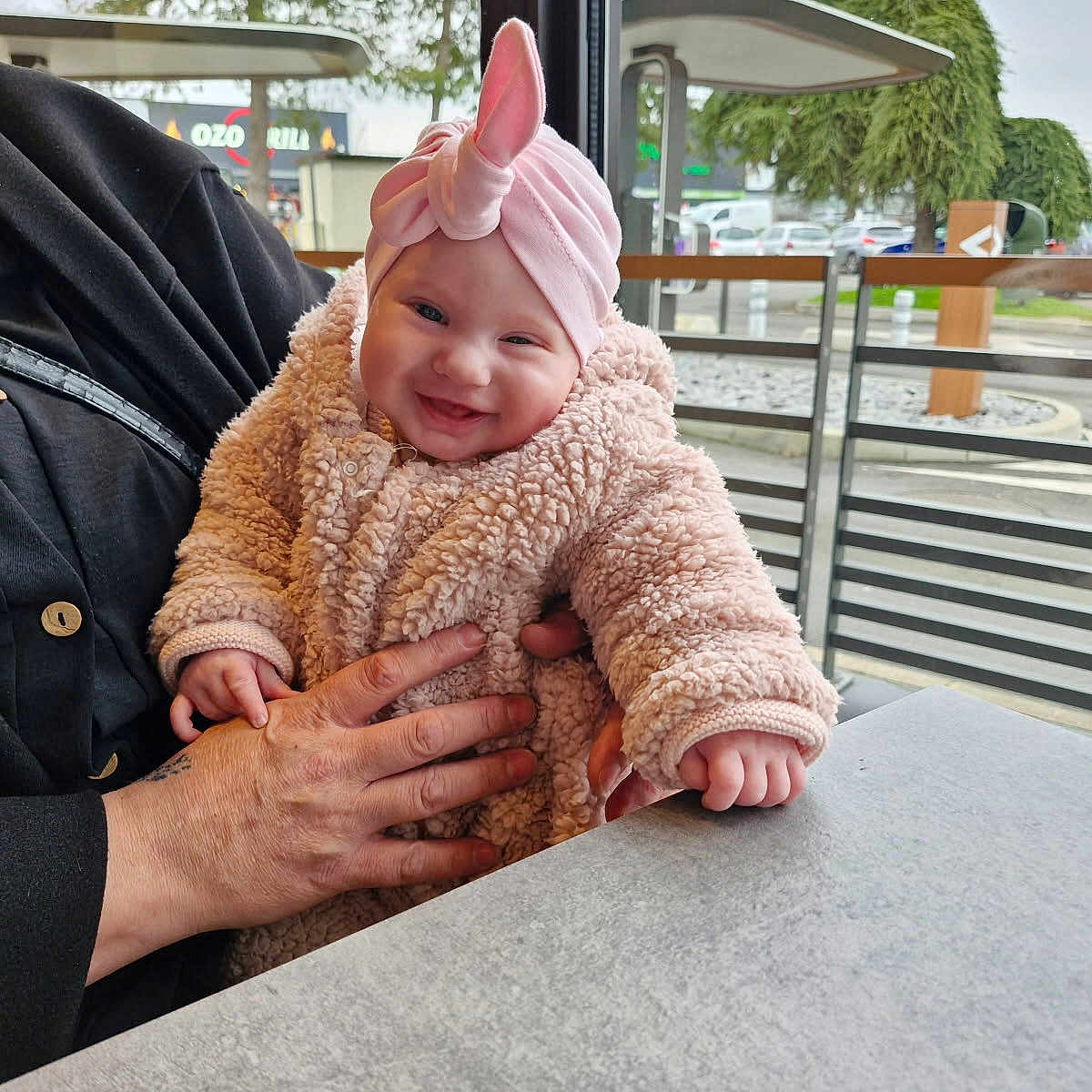 Lisana participe au concours pour gagner de l'argent avec cette photo : accessories, baby, cap, city, clothing, coat, face, hat, head, jacket, jewelry, knitwear, necklace, person, photography, plant, portrait, pottedplant, sweater, tree