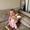 Isabella joined the competition — help win amazing prizes! baby, smiling, plush_toy, bunny, pink_clothing, couch, indoor, child, portrait, happy, infant, furniture, home_interior, mirror, door, seated, cute, soft_toy, cozy, playful