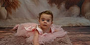 Kataléa a rejoint le concours — aidez-le/la à gagner de superbes lots ! baby, child, crawling, curious, cute, decor, expression, female, flooring, fluffy_rug, indoor, infant, pearls, pink_dress, plants, portrait, studio, tulle, vase, wooden_floor