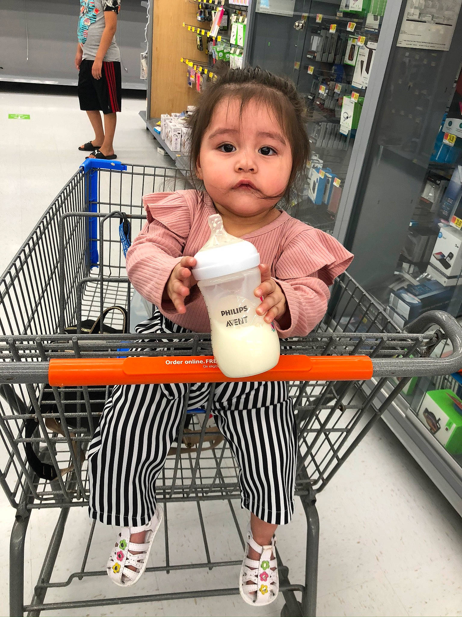 Jayleen is registered to the contest to win money with this photo: child, person, shopping_cart, snapshot, supermarket, toddler, vehicle