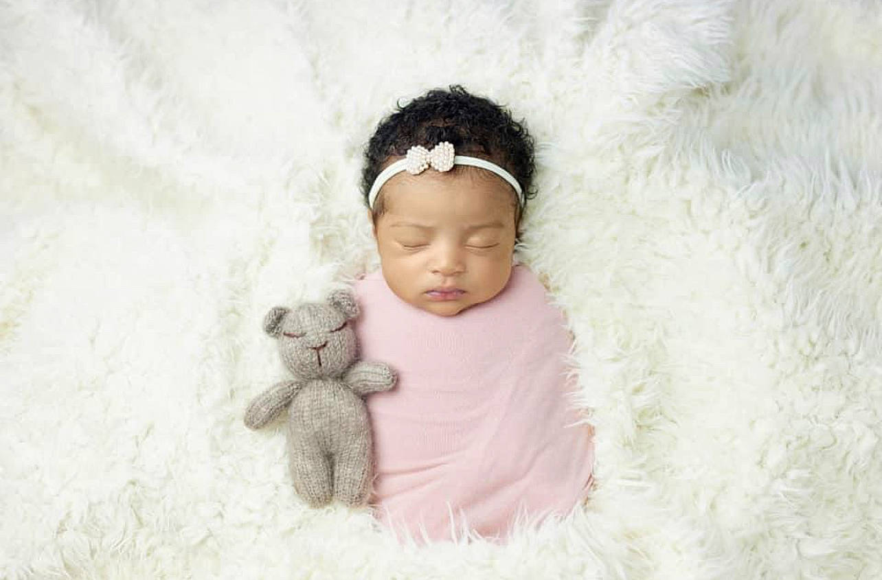 Zuri joined the competition — help win amazing prizes! art, baby, baby_sleeping, baby_toddler_clothing, cap, comfort, dress, eye, face, fawn, fur_clothing, happy, head, headgear, headwear, linens, person, teddy_bear, textile, toddler
