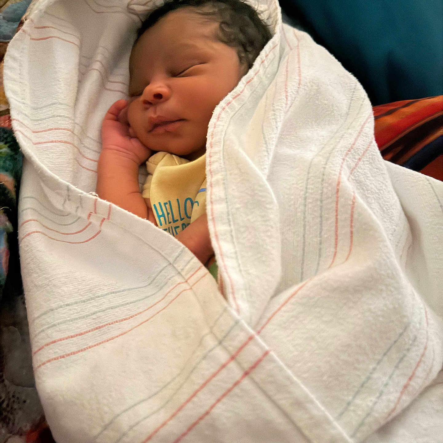 Lazarus joined the competition — help win amazing prizes! newborn, baby, sleeping, wrapped, blanket, soft, infant, peaceful, cute, face, hand, yellow_clothing, striped_blanket, resting, indoors, portrait, cozy, closeup, child, person