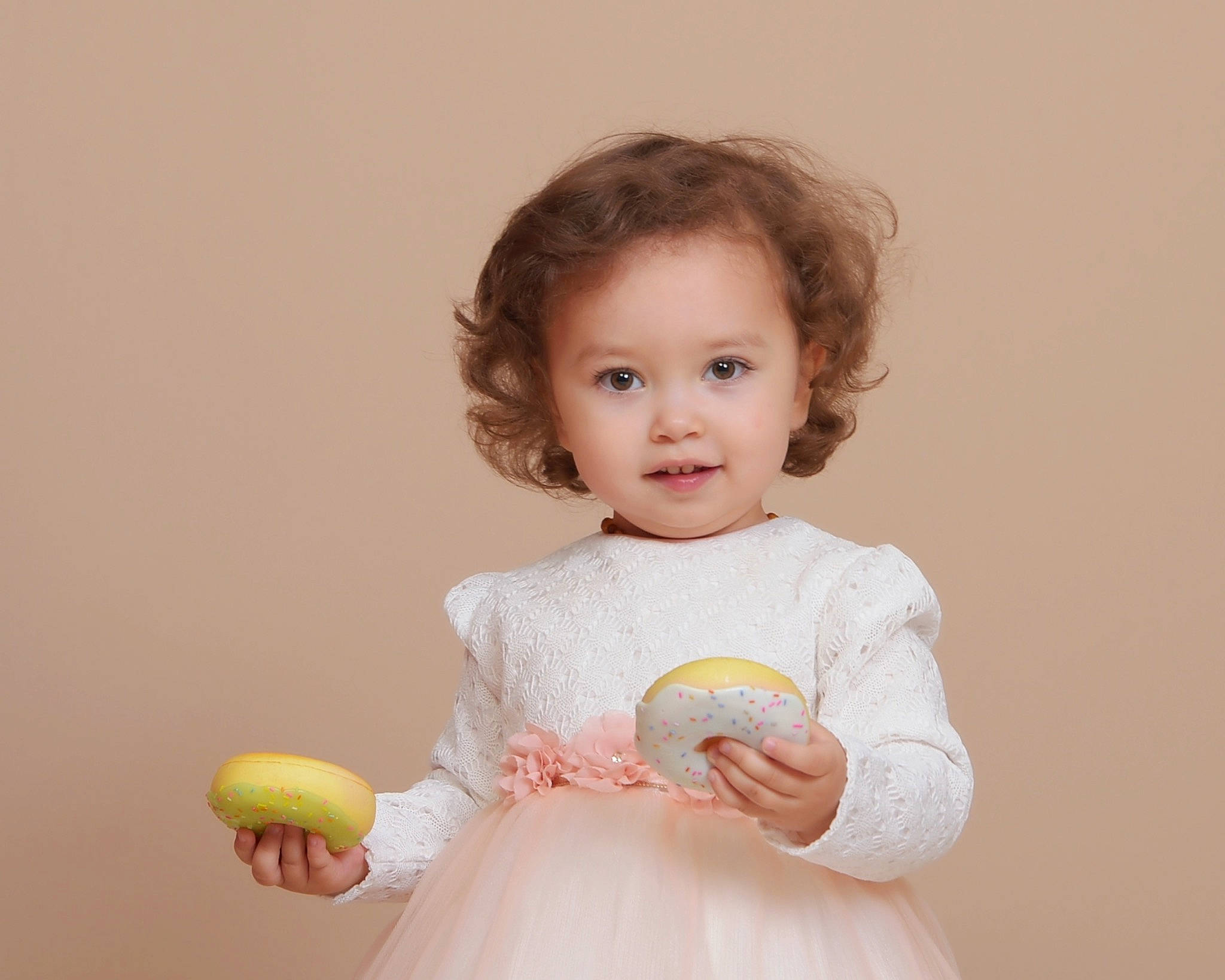 Amalia is registered to the contest to win money with this photo: arm, baby, baby_toddler_clothing, cheek, day_dress, dress, facial_expression, finger, gesture, hand, happy, iris, joint, lip, neck, one_piece_garment, person, shoulder, skin, sleeve