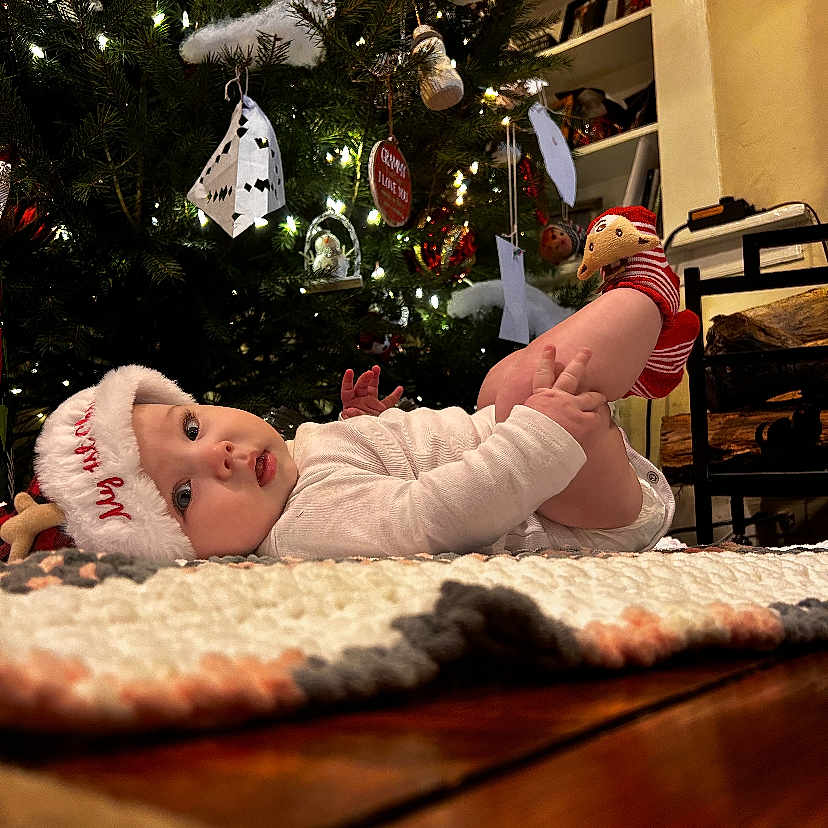 Charleigh joined the competition — help win amazing prizes! accessories, architecture, baby, bonnet, cap, clothing, couch, face, fir, furniture, hardwood, hat, head, newborn, person, photography, plant, portrait, tree, wood