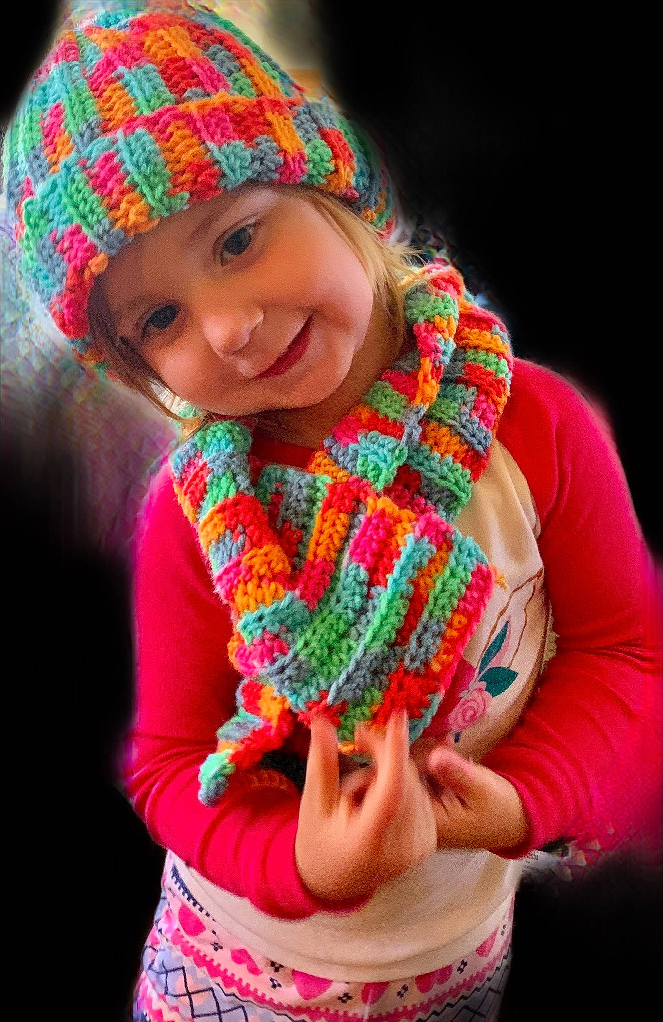 Adyson is registered to the contest to win money with this photo: art, beanie, cap, child, clothing, crochet, fashion_accessory, hat, headgear, joy, knit_cap, knitting, magenta, neck, person, photography, scarf, smile, textile, toddler