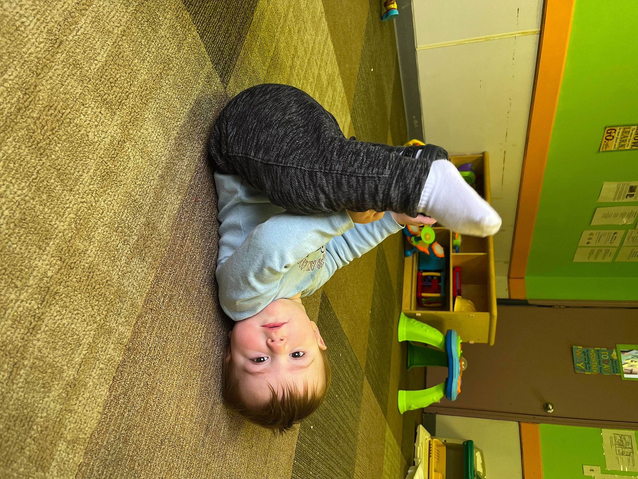 Boone is registered to the contest to win money with this photo: baby, baby_toddler_clothing, barefoot, child, comfort, elbow, flooring, foot, hardwood, human_leg, knee, leg, linens, pattern, person, room, sitting, sock, thigh, toddler