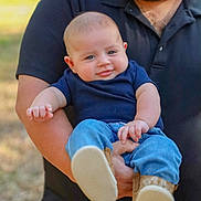 Garrett joined the competition — help win amazing prizes! baby, clothing, coat, face, footwear, grass, head, jacket, jeans, newborn, pants, people, person, photography, plant, portrait, shoe, shorts, sitting, t_shirt