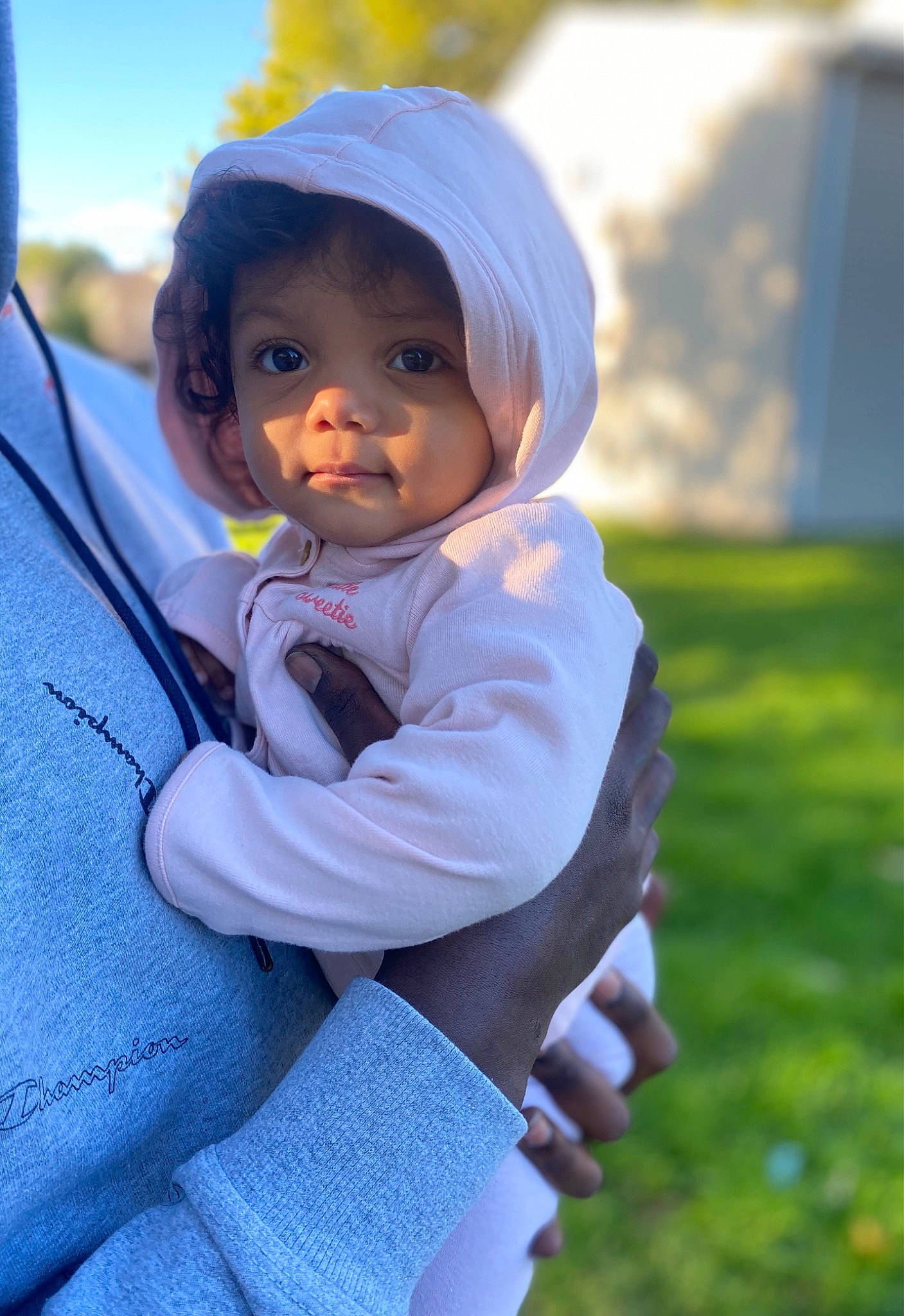 Xolani joined the competition — help win amazing prizes! baby, beanie, cap, child, electric_blue, fun, gesture, grass, happy, headwear, hoodie, leisure, people_in_nature, person, plant, portrait_photography, recreation, sitting, toddler, tree