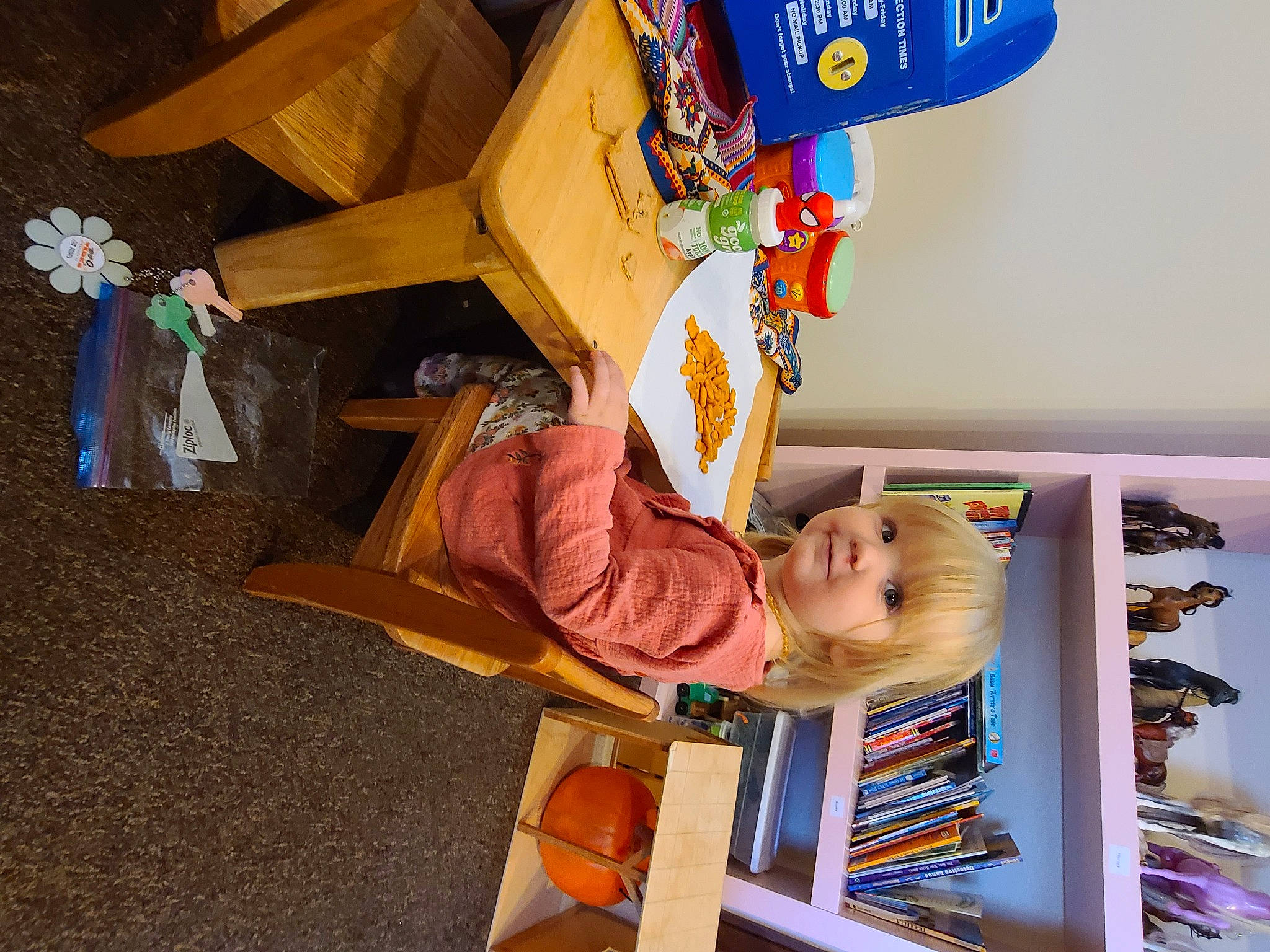 Amber is registered to the contest to win money with this photo: baby, baby_products, baby_toys, bookcase, building, chair, child, fun, happy, hat, person, play, room, shelf, shelving, sitting, smile, toddler, toy, wood