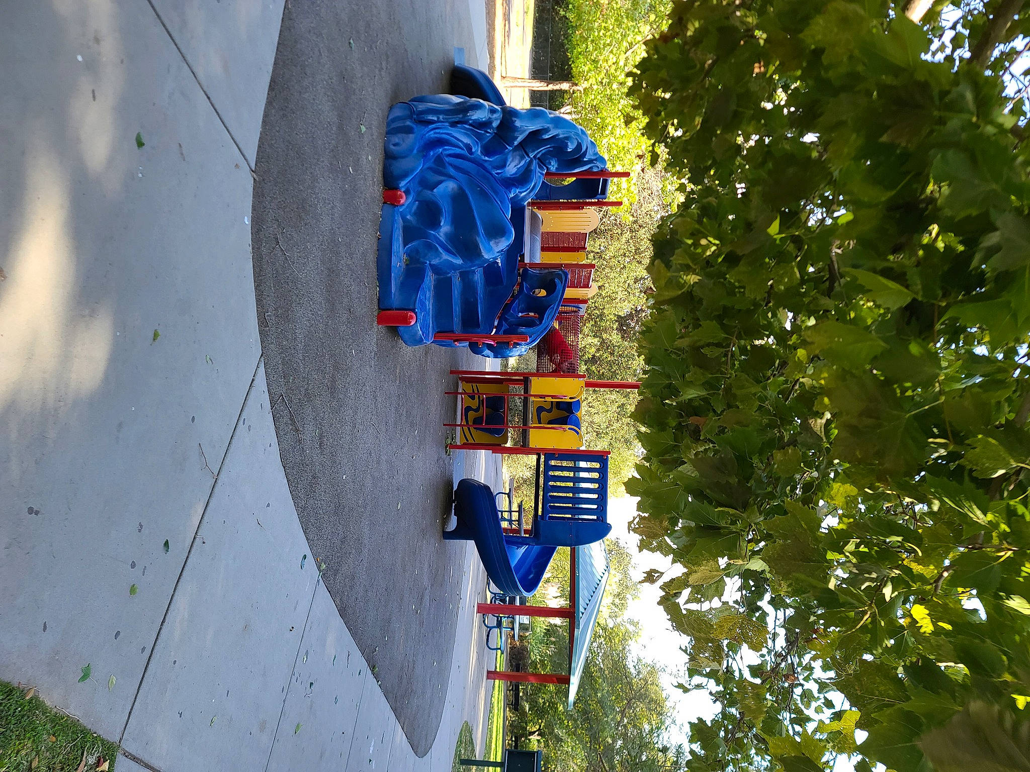 Scarlette is registered to the contest to win money with this photo: art, azure, concrete, electric_blue, electricity, facade, leisure, plant, pole, public_utility, road, signage, sky, street, tints_and_shades, town, tree, urban_design, wheel, world