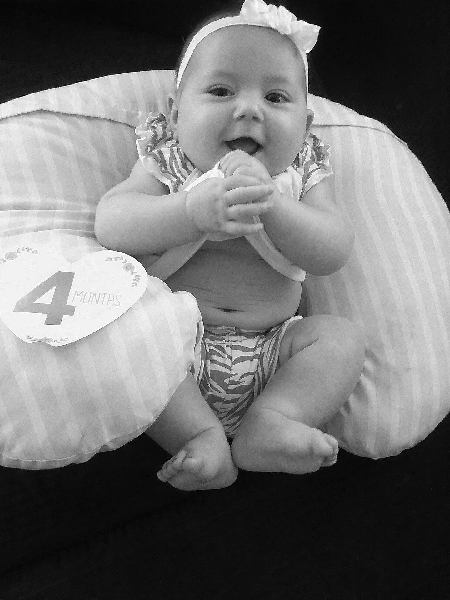 Lynzee is registered to the contest to win money with this photo: arm, beauty, black, black_and_white, child, girl, hand, human, infant, monochrome, monochrome_photography, person, photograph, photography, sitting, skin, smile, standing, toddler, white