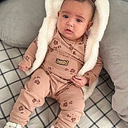 Xarielis joined the competition — help win amazing prizes! baby, child, infant, pajamas, hood, bear_ears, necklace, white_shoes, blanket, pillow, indoor, cute, cozy, portrait, sitting, pattern, clothing, soft_fabric, relaxed, home