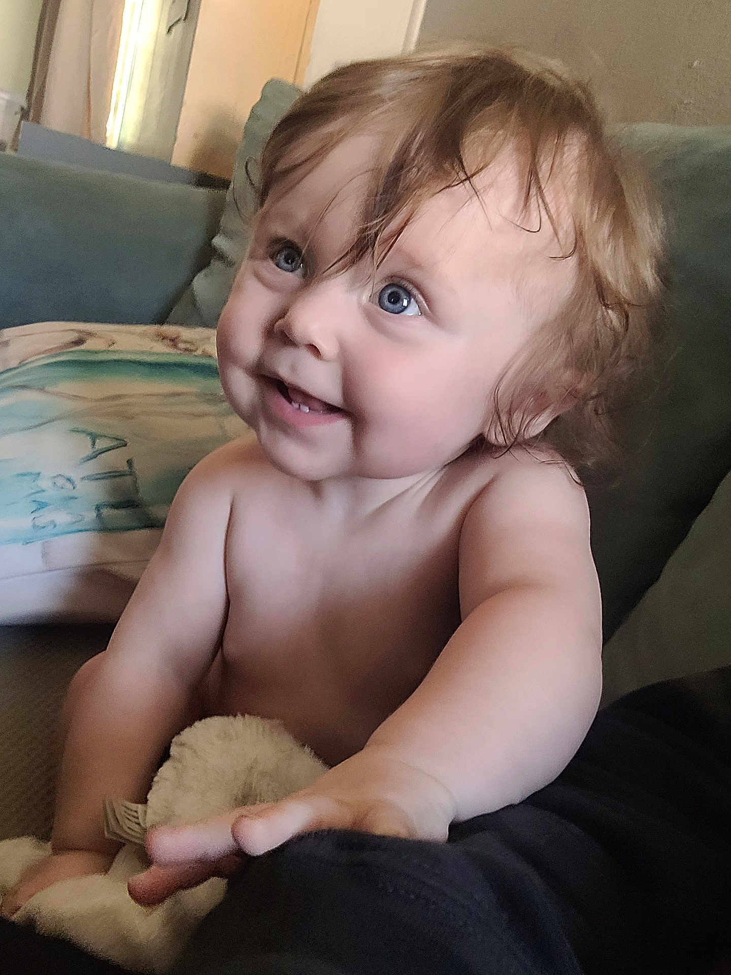 Steelie joined the competition — help win amazing prizes! baby, child, blue_eyes, curly_hair, plush_toy, couch, cushion, indoors, smiling, happy, skin, arm, hand, person, portrait, infant, cute, toddler, expression, closeup