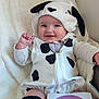 Magdalena is registered to the contest to win money with this photo: baby, infant, smiling, costume, dalmatian, black_and_white, milestone_card, four_months, blanket, cute, child, indoors, soft_texture, clothing, portrait, happy, young, sitting, headwear, face