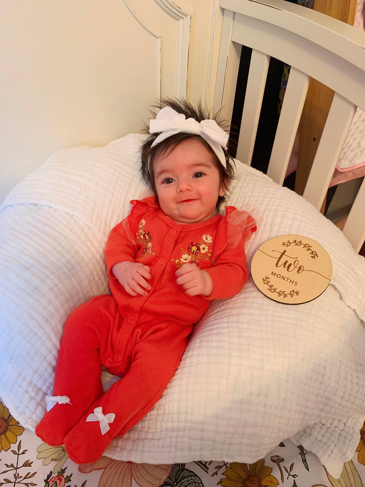 Wrenlee joined the competition — help win amazing prizes! baby, baby_toddler_clothing, chair, child, comfort, couch, event, fun, happy, headgear, holiday, lap, linens, pattern, peach, person, pink, room, sitting, smile