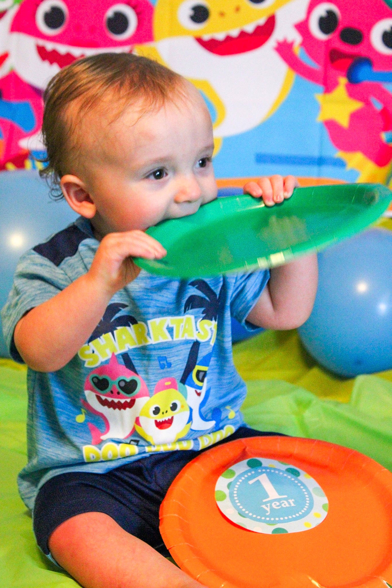 Journee is registered to the contest to win money with this photo: arm, baby, baby_playing_with_toys, baby_toddler_clothing, blue, facial_expression, fun, hairstyle, happy, leisure, orange, organ, person, photograph, pink, product, red, summer, t_shirt, toddler