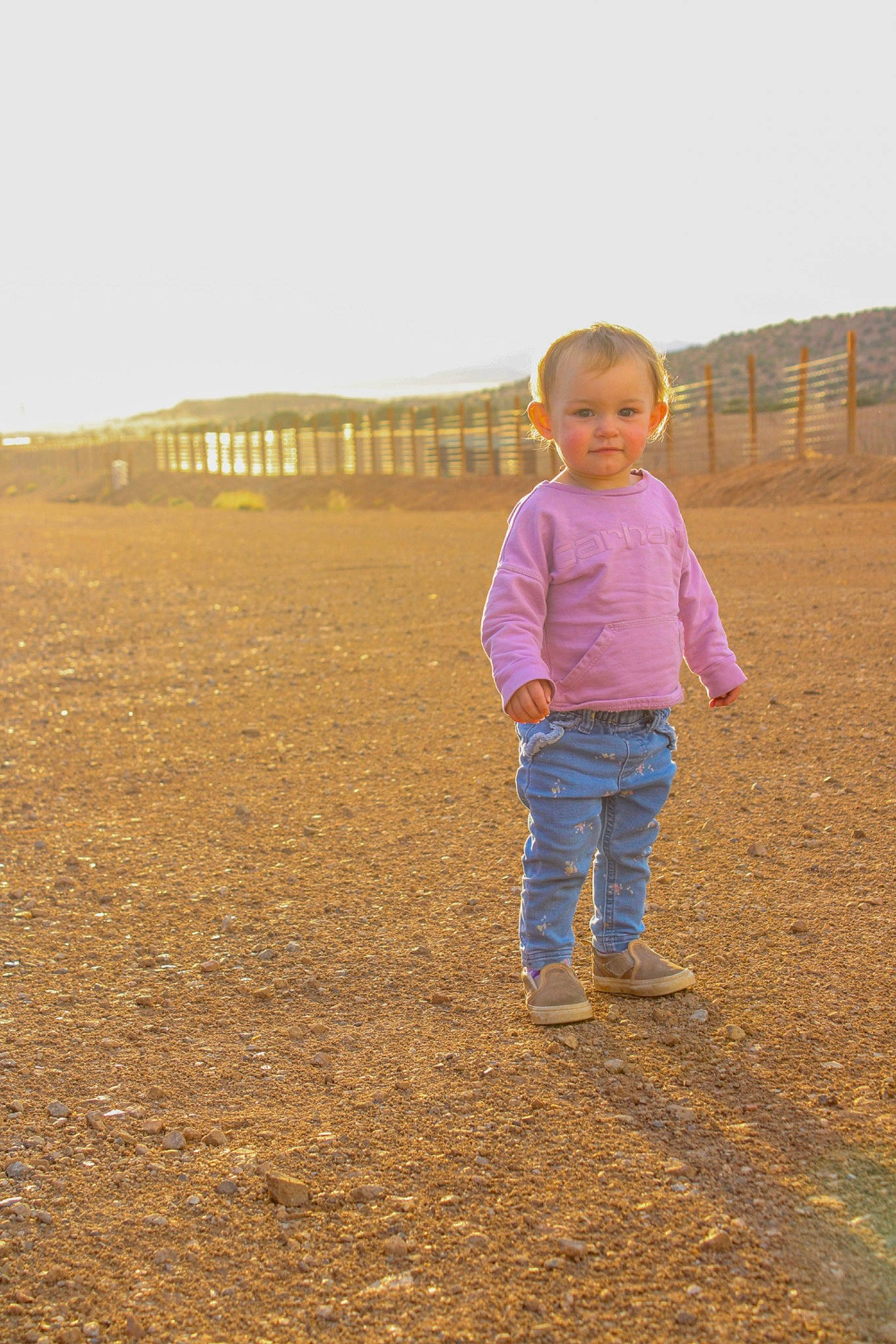 Journee joined the competition — help win amazing prizes! baby_toddler_clothing, child, ecoregion, field, fun, gesture, grass, grassland, happy, horizon, landscape, mammal, people_in_nature, person, plain, prairie, sky, sleeve, toddler, travel