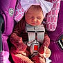 newborn, baby, sleeping, car_seat, purple, headband, bow, onesie, infant, safety_harness, cute, child, closed_eyes, soft_lighting, indoor, small_person, wrapped, peaceful, clothing, resting