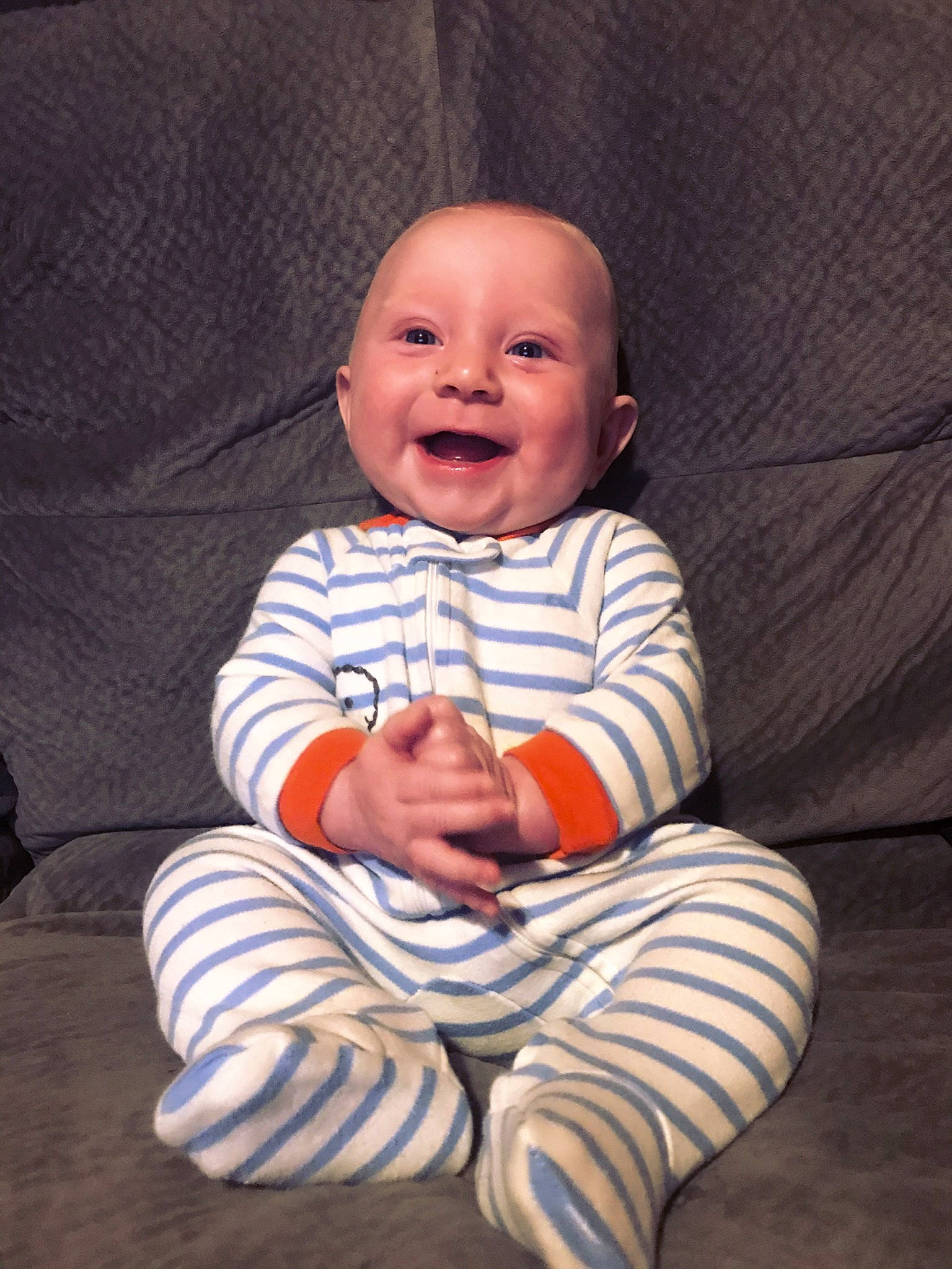 Deegan joined the competition — help win amazing prizes! arm, baby, cheek, child, face, facial_expression, head, mouth, person, sitting, skin, smile, toddler