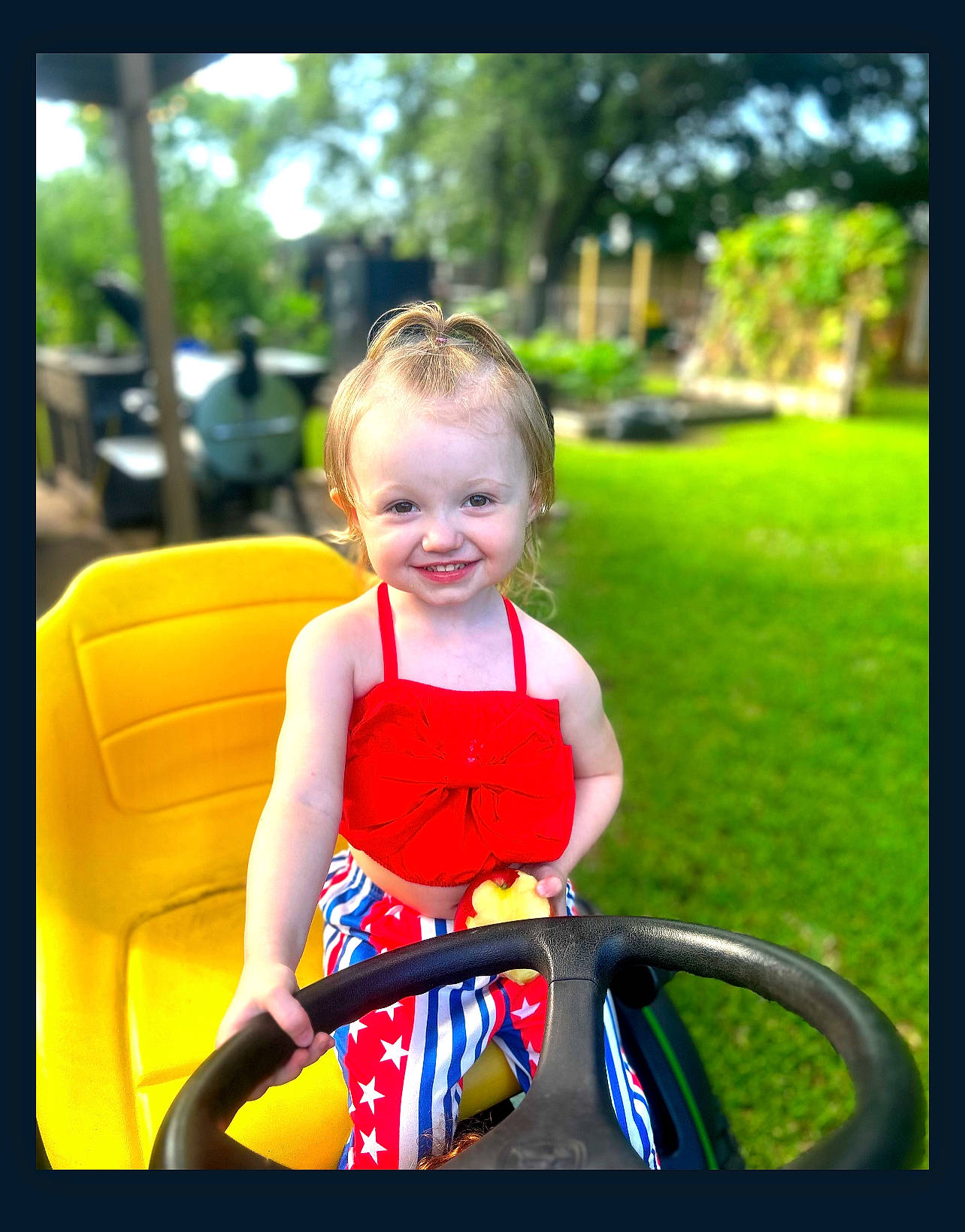 Laiken is registered to the contest to win money with this photo: auto_part, baby, baby_carriage, baby_toddler_clothing, child, electric_blue, fun, grass, happy, joy, leisure, motor_vehicle, people_in_nature, person, plant, recreation, riding_toy, smile, steering_wheel, toddler