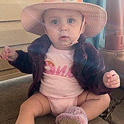 Ivy is registered to the contest to win money with this photo: baby, child, hat, pink, slippers, jacket, outdoor, concrete, plastic_chair, toy, sunlight, curious, sitting, face, person, apparel, footwear, cute, infant, portrait