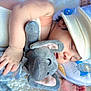 Ethan is registered to the contest to win money with this photo: baby, sleeping, plush_toy, elephant, hat, blanket, bib, hand, face, infant, soft_toy, cozy, cute, rest, child, peaceful, nap, comfort, indoors, closeup