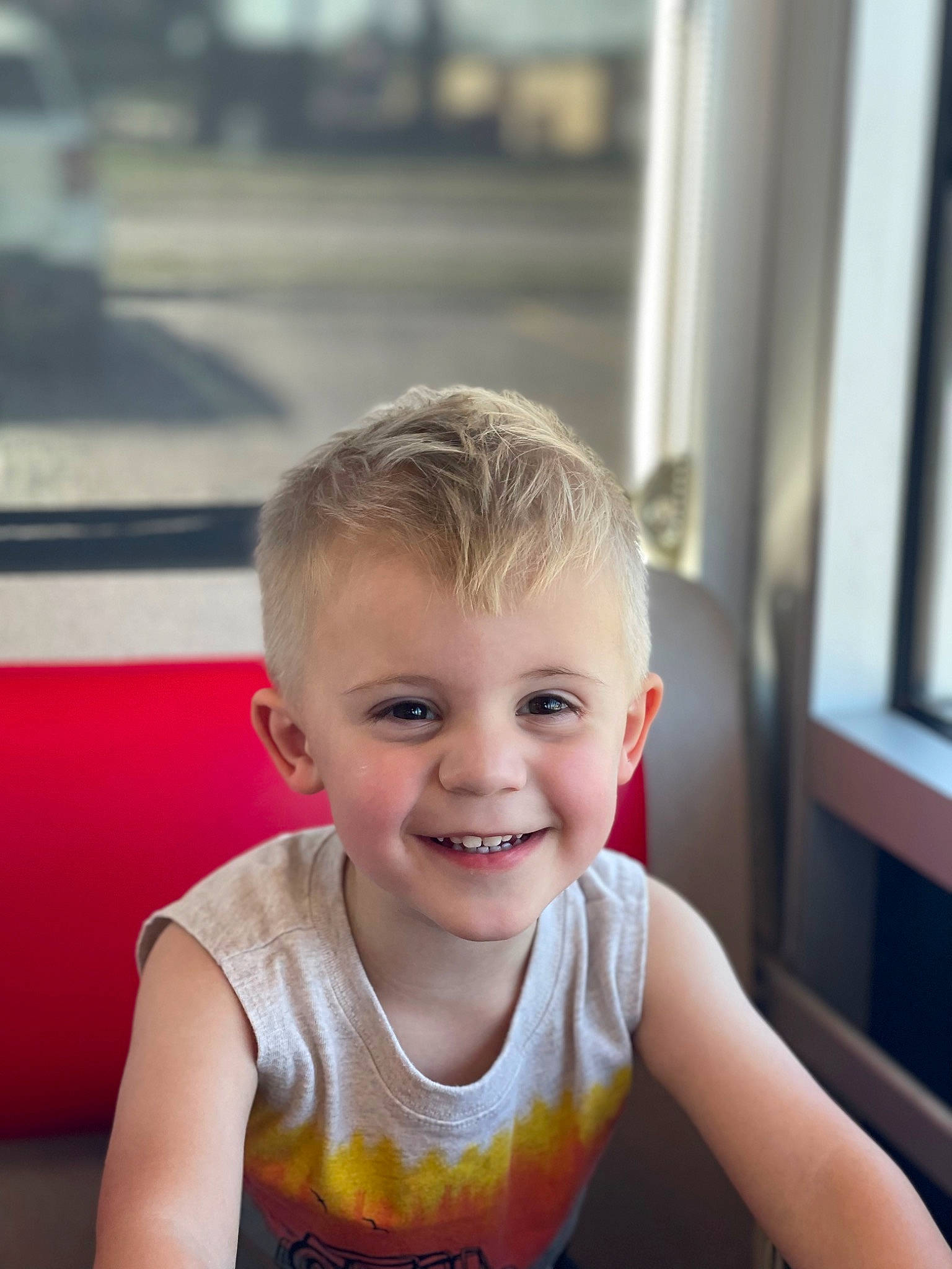 Judson is registered to the contest to win money with this photo: active_tank, baby_toddler_clothing, cheek, chest, child, eye, eyelash, fun, happy, iris, joy, leisure, person, recreation, sitting, skin, sleeveless_shirt, smile, t_shirt, toddler