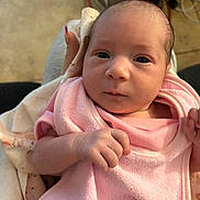Savannah is registered to the contest to win money with this photo: baby, newborn, infant, pink_towel, hand, face, eyes, blanket, clothing, person, skin, cute, portrait, indoors, young, small, cozy, soft, human, newborn_baby