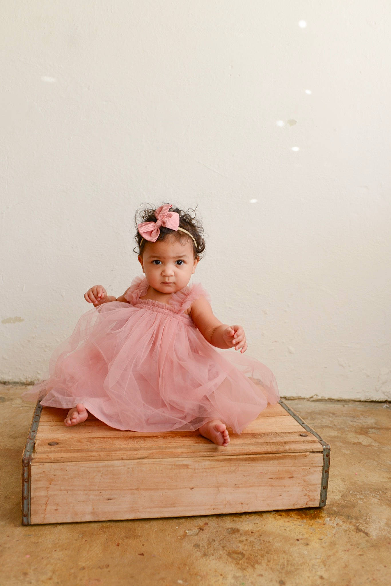 Taytum is registered to the contest to win money with this photo: baby_toddler_clothing, bridal_accessory, day_dress, dress, embellishment, fashion_design, flash_photography, flooring, happy, hardwood, head, headgear, headpiece, human_body, peach, person, pink, sleeve, toddler, vintage_clothing