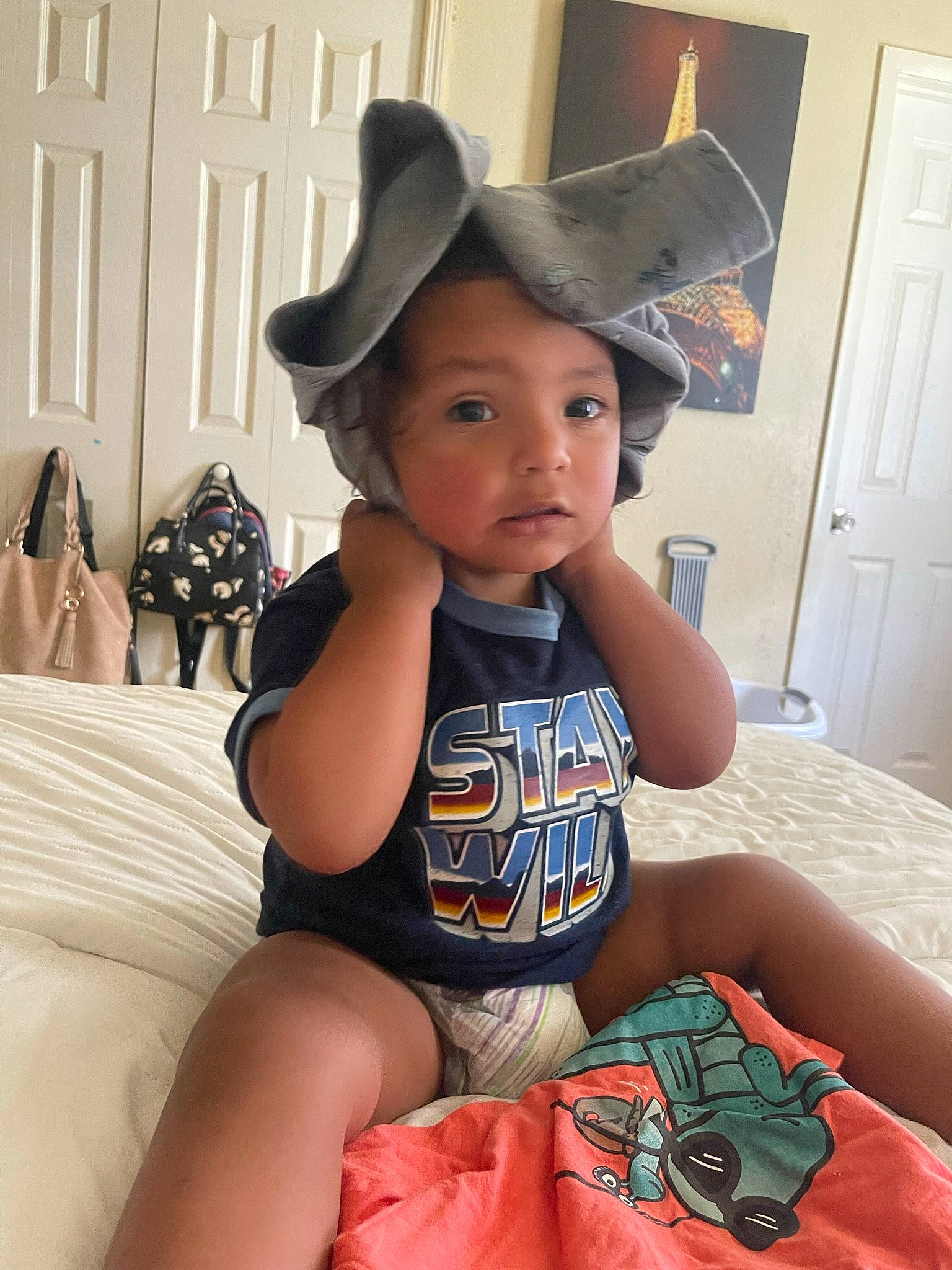 Aiden joined the competition — help win amazing prizes! baby, baby_toddler_clothing, cabinetry, cap, child, door, fashion_accessory, fun, happy, hat, headwear, human_leg, mammal, pattern, person, sitting, sleeve, sun_hat, t_shirt, thigh