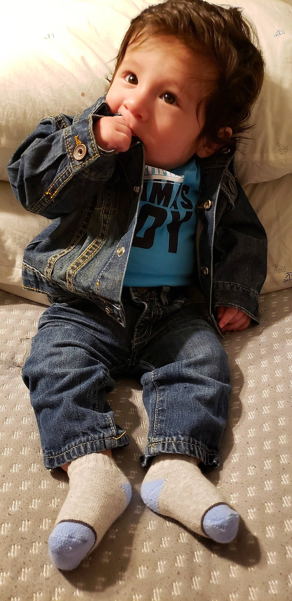 Jorge is registered to the contest to win money with this photo: baby, cheek, child, cool, denim, jacket, jeans, joy, leg, outerwear, person, sitting, sleeve, textile, toddler