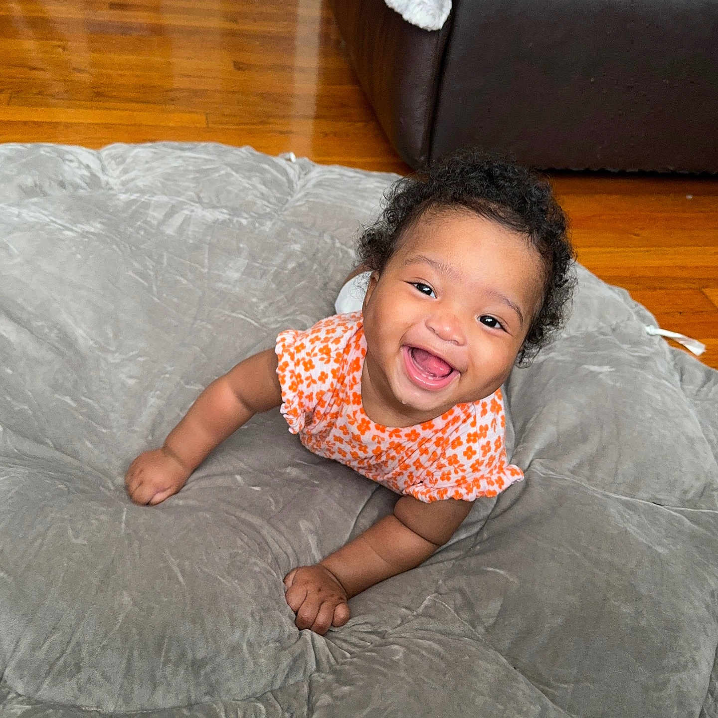 Salah is registered to the contest to win money with this photo: baby, babylaughing, bed, bedroom, couch, crawling, cushion, face, furniture, happy, hardwood, head, homedecor, indoors, laughing, person, photography, portrait, smile, wood