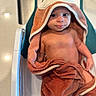 baby, child, towel, bath, bathtub, cute, face, skin, hooded_towel, infant, person, sitting, expression, indoors, soft_texture, comfort, young, wrapped, playful, cleaning