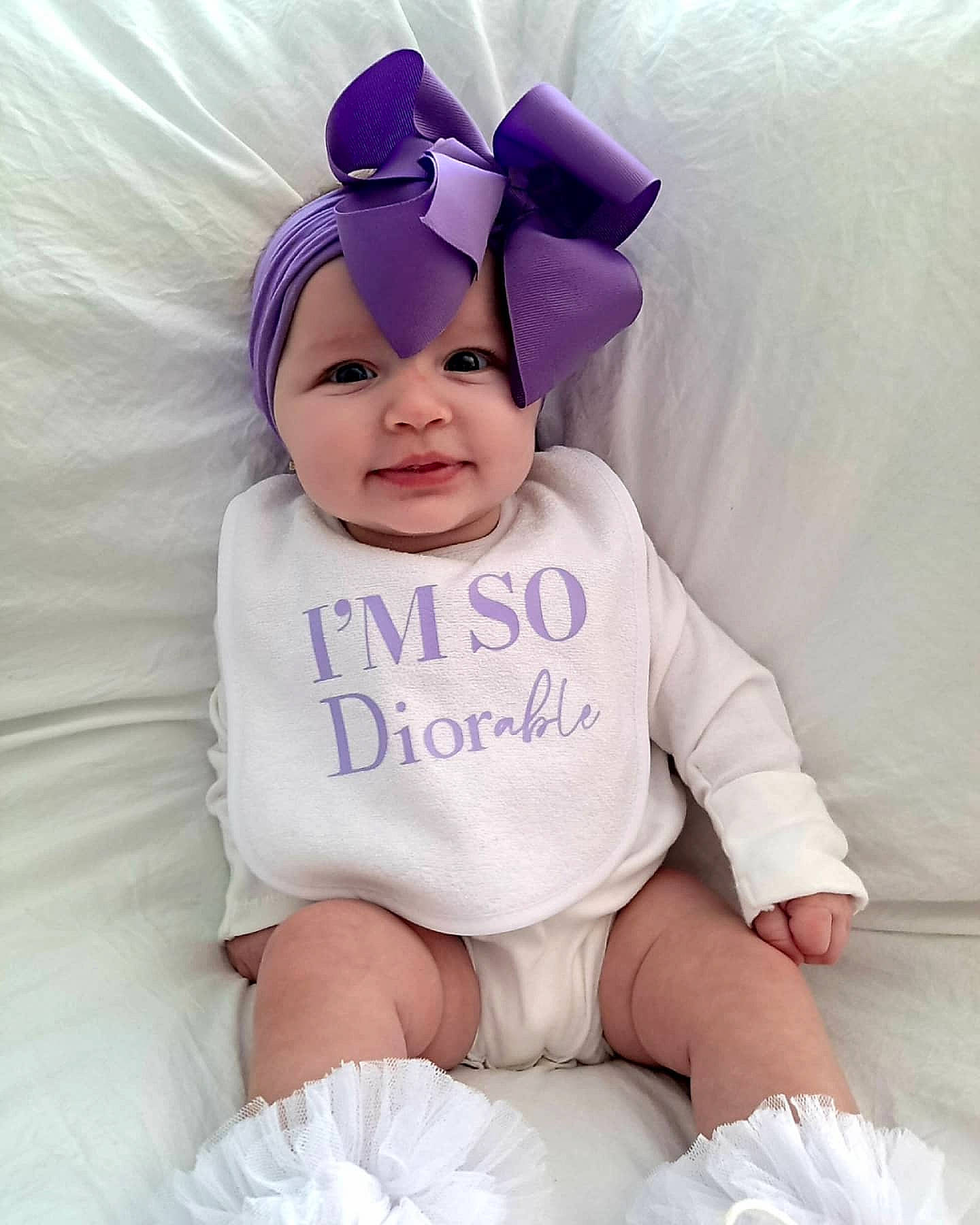 Noa joined the competition — help win amazing prizes! baby, baby_toddler_clothing, beauty, blue, child, costume_hat, eye, face, happy, head, headgear, headwear, person, pink, product, purple, skin, sleeve, smile, textile