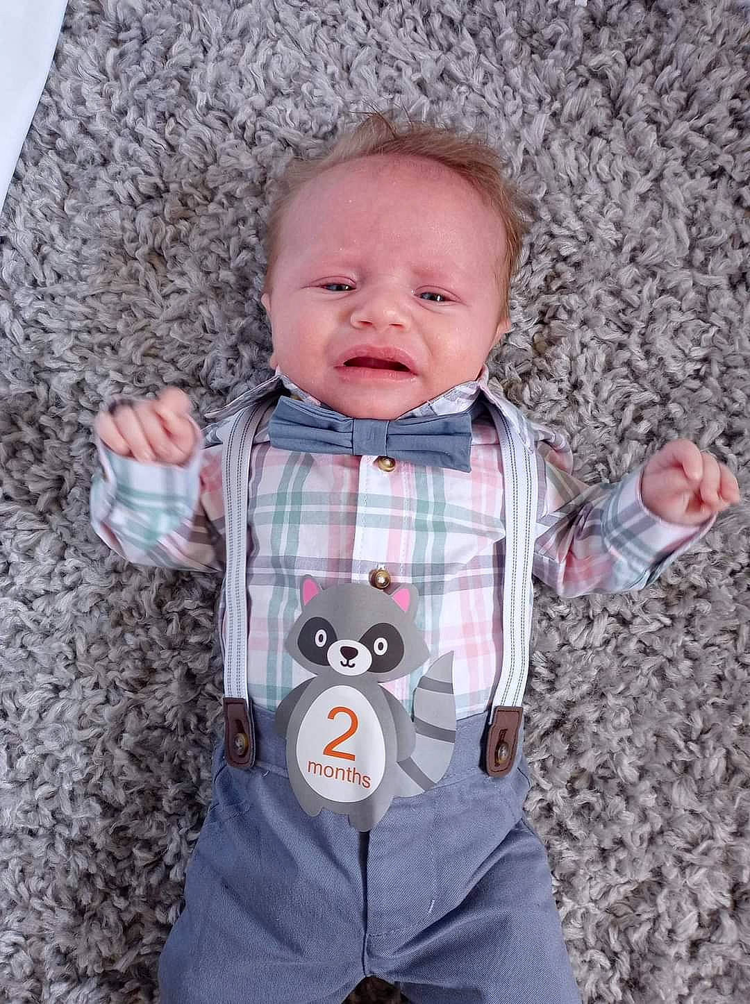 Blake is registered to the contest to win money with this photo: baby, baby_toddler_clothing, cheek, child, clothing, grey, happy, head, jacket, mouth, organ, outerwear, pattern, person, pink, product, skin, sleeve, standing, textile