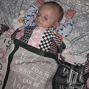 Isaiah joined the competition — help win amazing prizes! baby, sleeping, blanket, bed, child, arms_up, patterned_blanket, floral_bedsheet, peaceful, rest, infant, cozy, indoors, pajamas, cute, face, head, young_child, comfort, relaxation